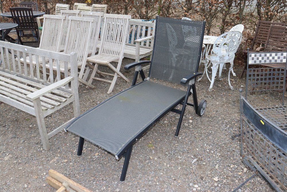 A metal framed garden lounger