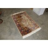 An approx. 5'3" x 3' floral patterned rug AF