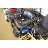 A CareCo electric wheelchair with charger, sold as