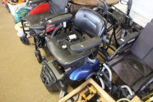 A CareCo electric wheelchair with charger, sold as