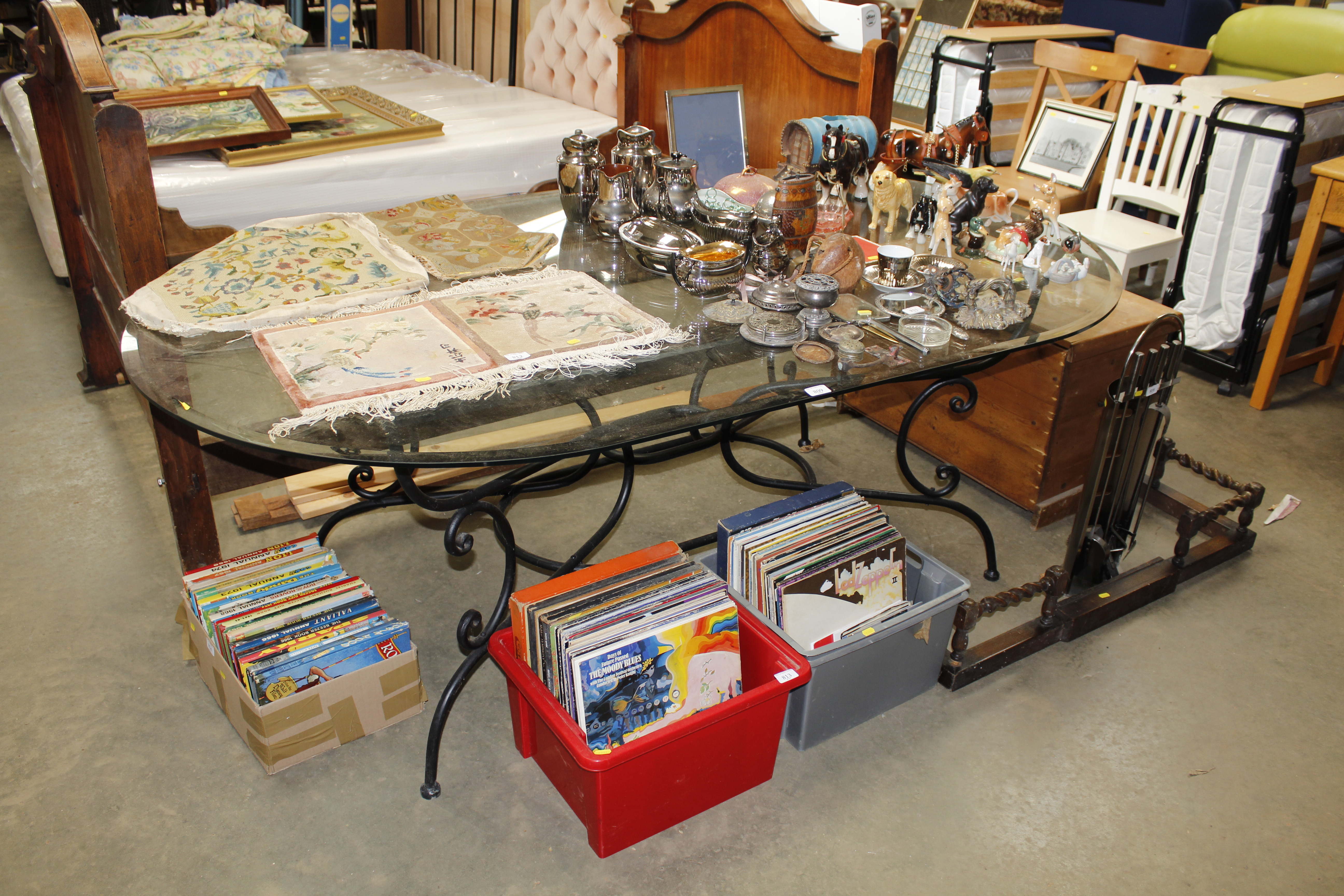 A metal framed glass topped dining table