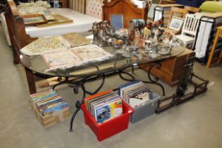 A metal framed glass topped dining table