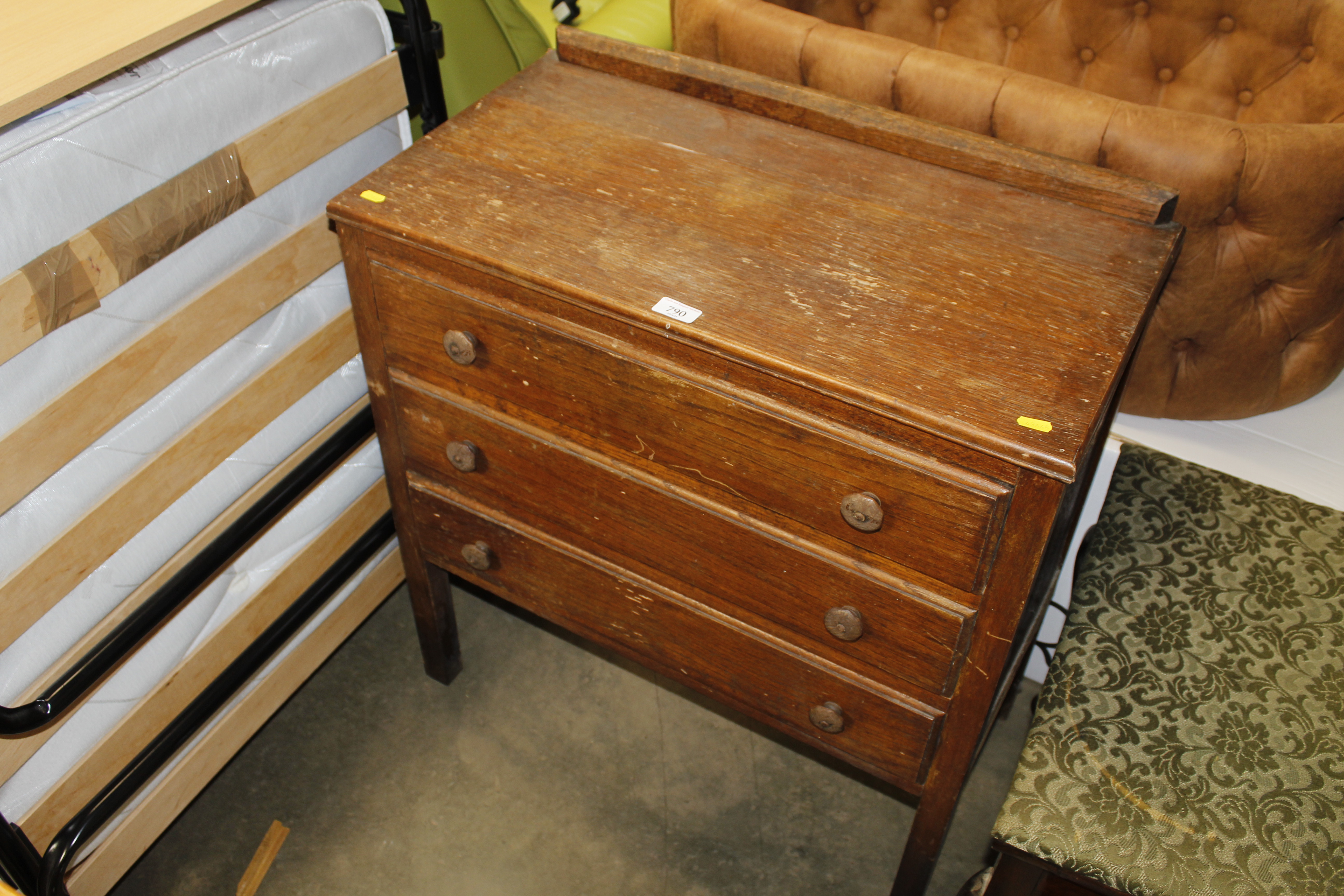 An oak chest fitted three drawers