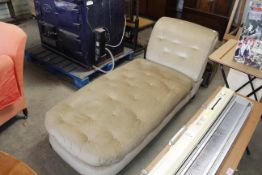 A buttoned upholstered day bed