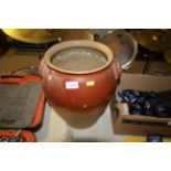 A part glazed stoneware twin handled pot