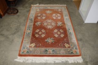 An approx. 7' x 4'1" floral patterned rug