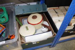 A box containing various enamel ware and a wall sh