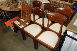 A set of six hardwood dining chairs