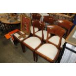A set of six hardwood dining chairs