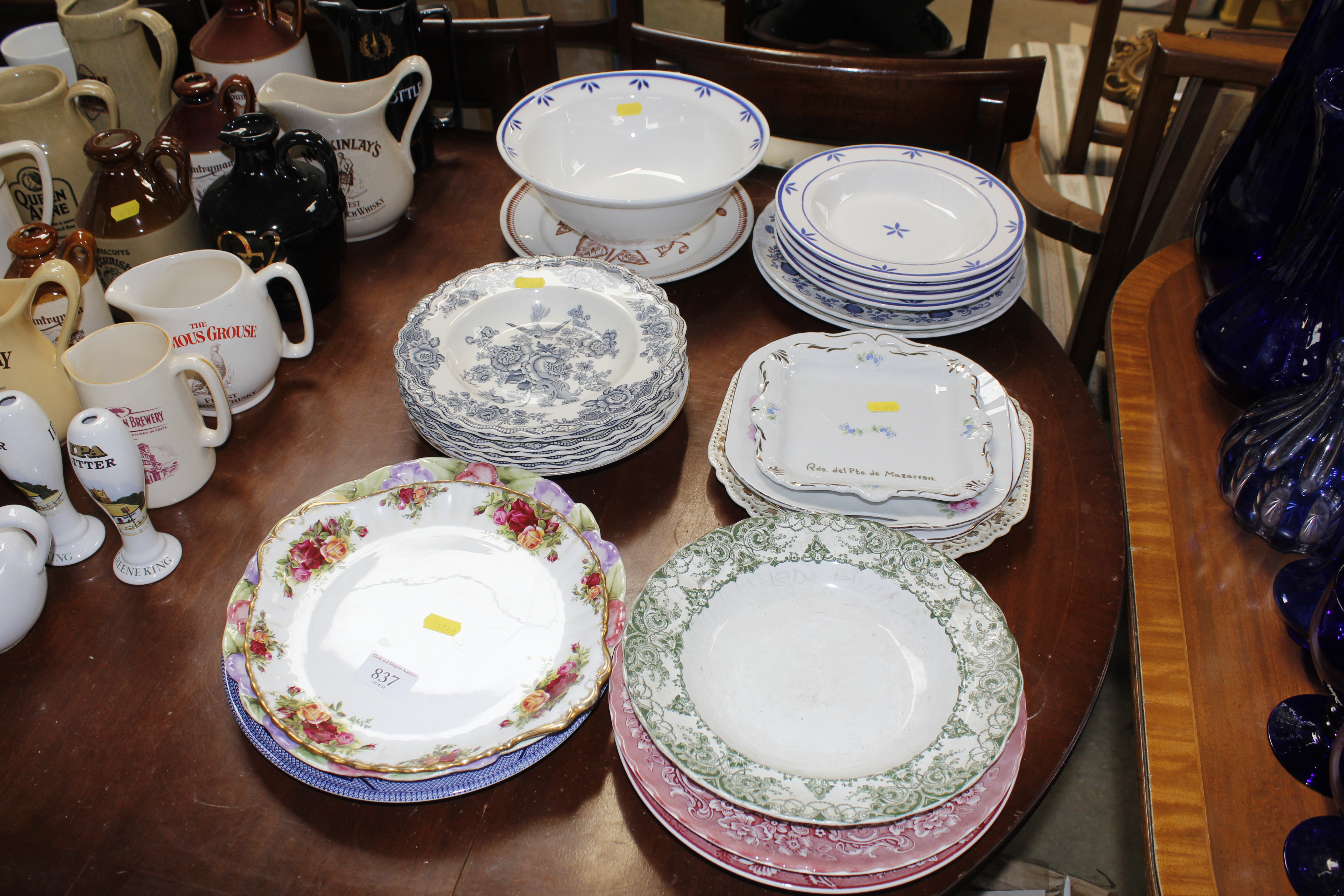 A collection of various dinner plates to include R