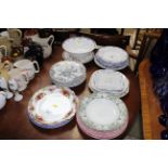 A collection of various dinner plates to include R