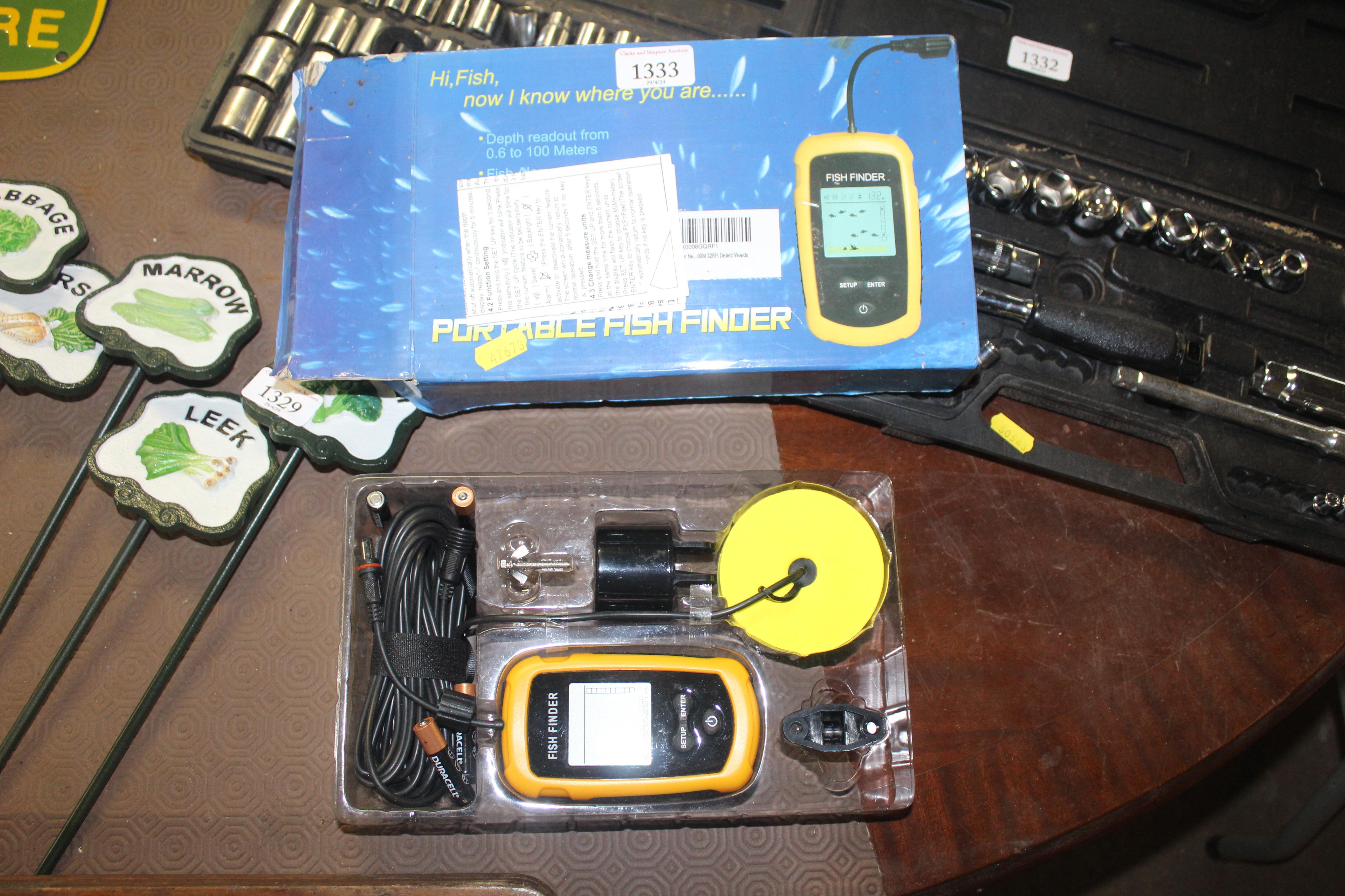 A portable fish finder device with original box