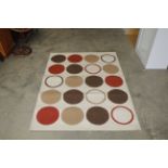 An approx. 5'3" x 4' modern patterned rug