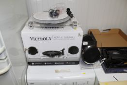 A Victrola acrylic turntable with wireless speaker