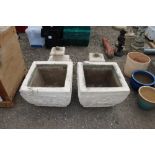 A pair of large painted concrete three sectional u