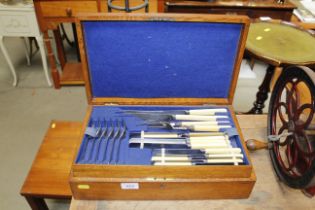 An oak cased canteen of cutlery