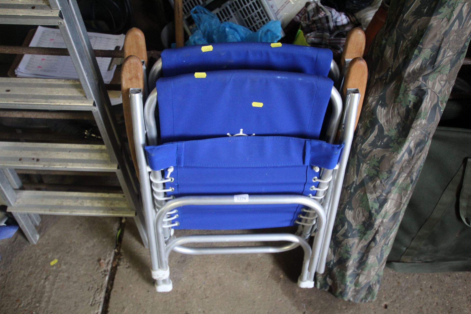 A pair of folding deck chairs