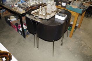 An Ikea metal framed table and set of four matchin