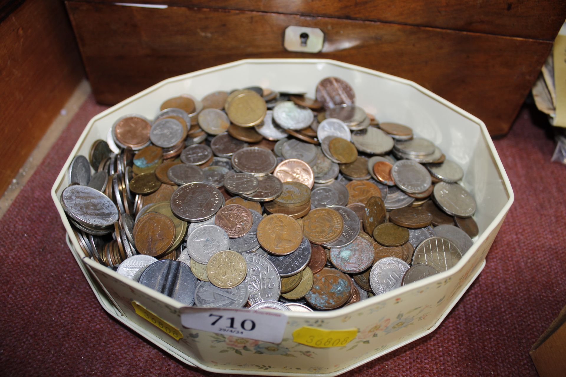 A tin containing various coinage