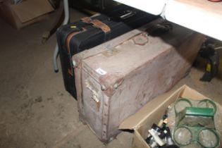 A vintage suitcase and one other