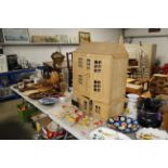 A wooden doll's house and various doll's furniture