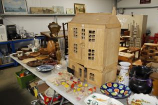 A wooden doll's house and various doll's furniture