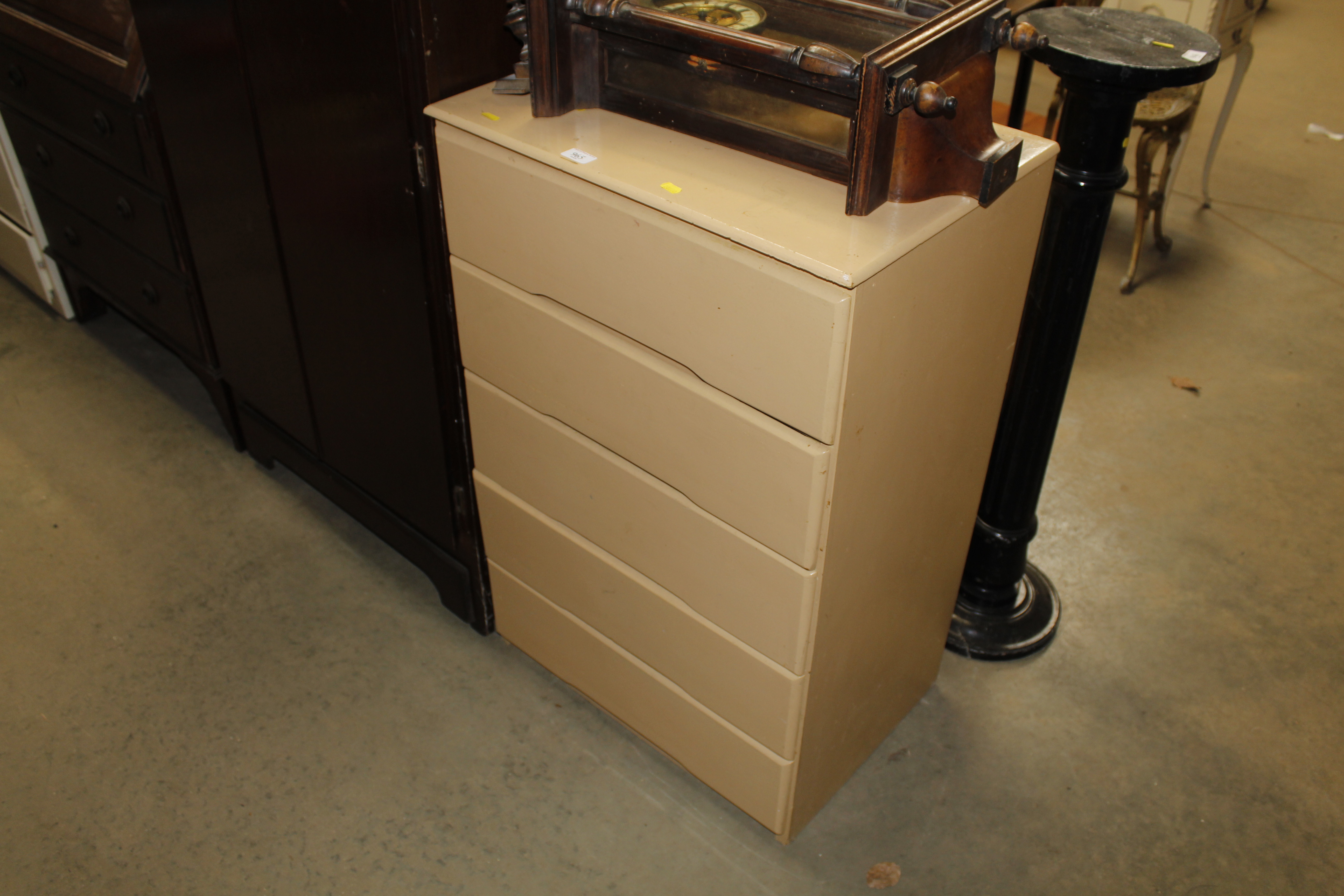 A painted wooden chest fitted five drawers