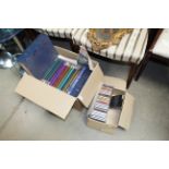 Two boxes containing books and CDs