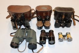 A box of various binoculars