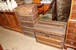 A vintage wooden and metal bound travelling trunk