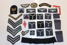 A bag of various military cloth badges
