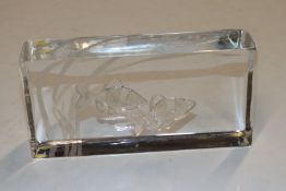 A Kosta glass paperweight decorated with fish