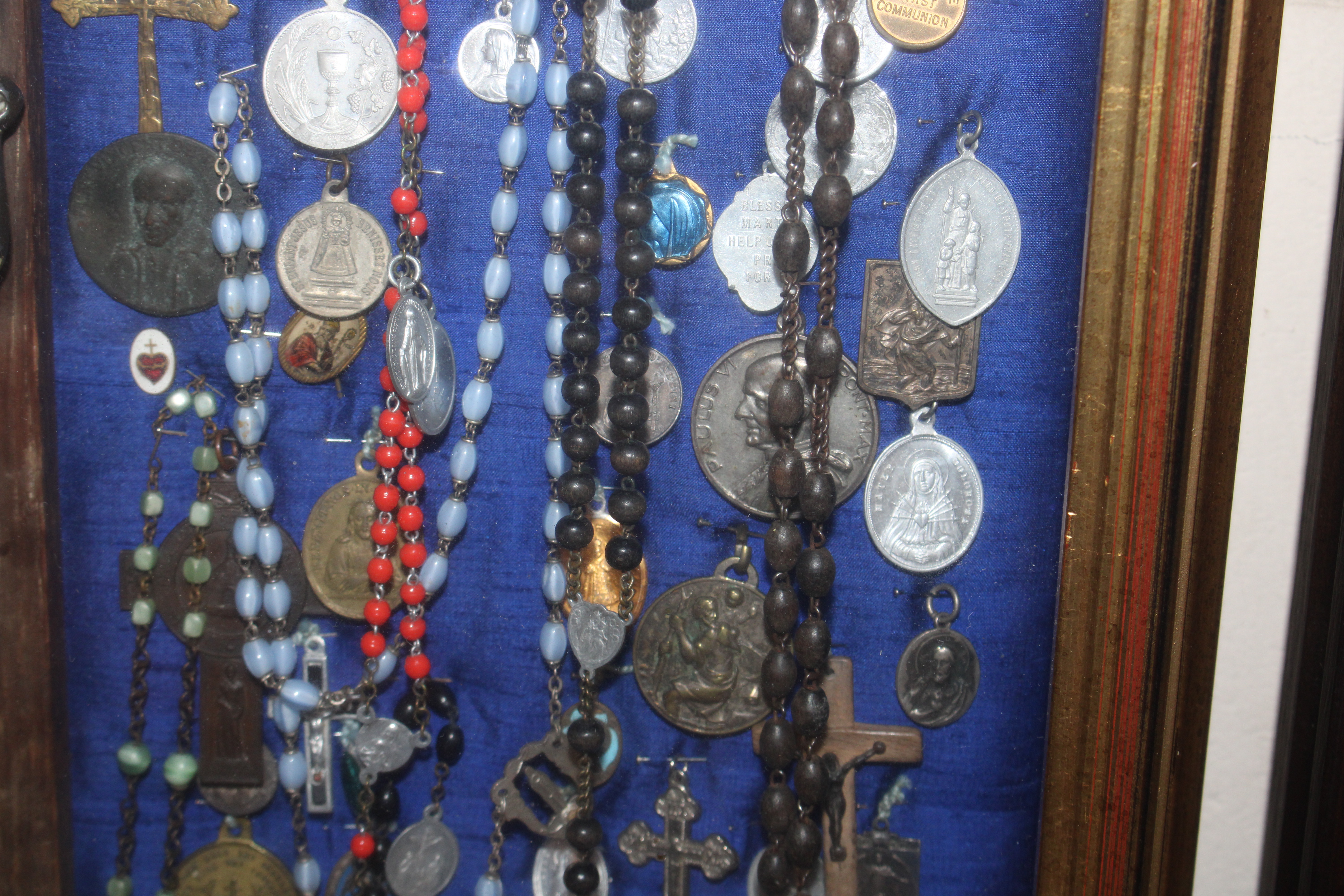 A display case of Papal medallions; rosary beads; - Image 8 of 13