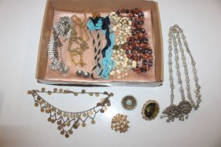 A tray of costume jewellery to include bead neckla