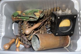 A crate of mixed ammo belts, shell cases etc.