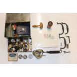 A box containing various sewing items, buttons, sc