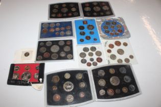 A box containing various cased coin collections
