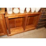 A pine open fronted bookcase