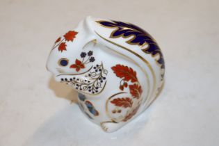 A Royal Crown Derby paperweight in the form of a s