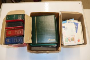 Three boxes containing various post-cards and Firs