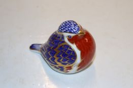 A Royal Crown Derby paperweight in the form of a r
