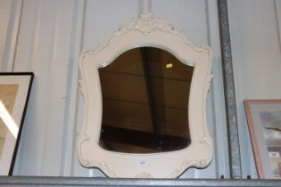 A white painted decorative wall mirror