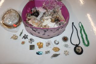 A case containing various costume jewellery