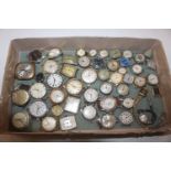 A tray of vintage and other watches for spares and