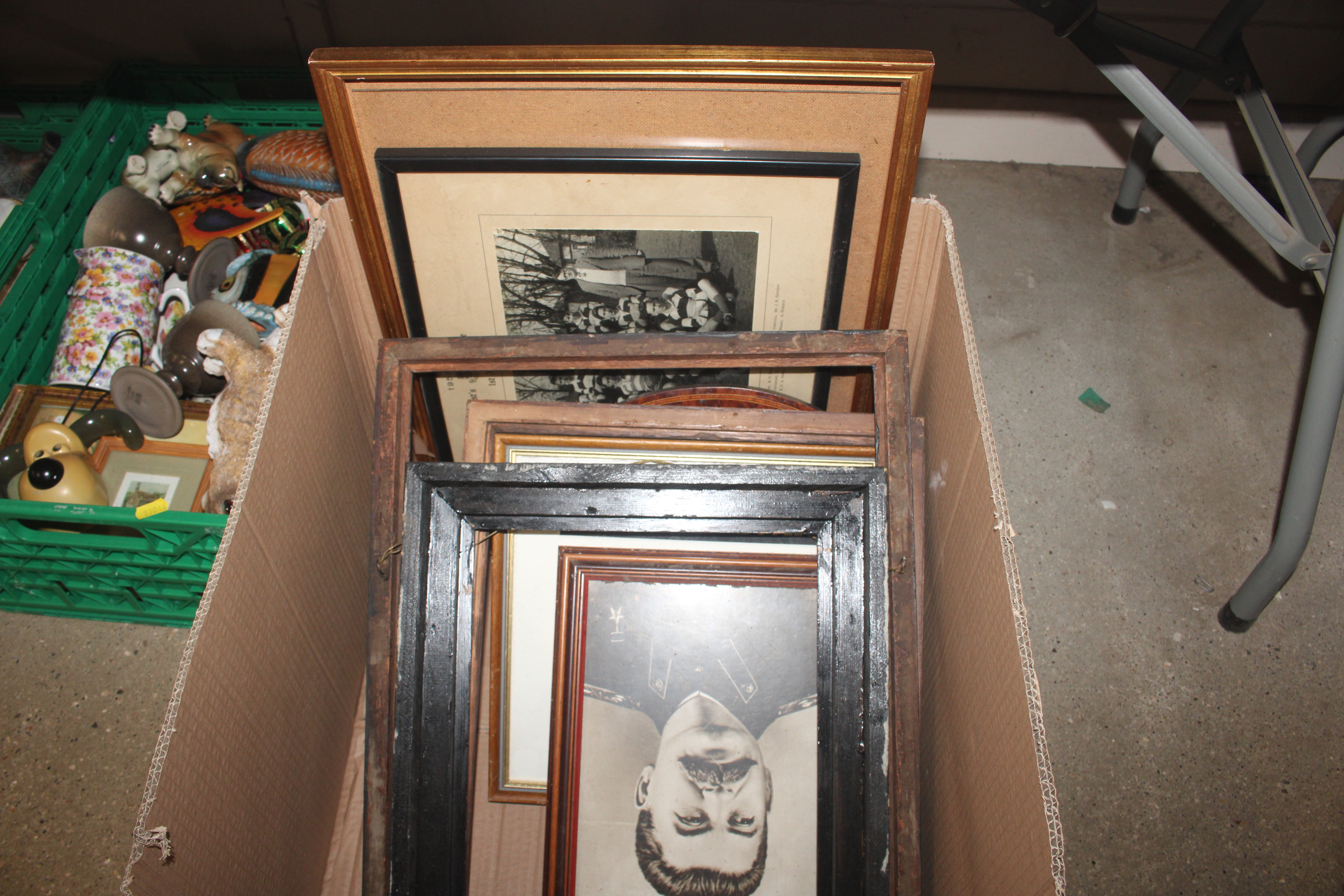 A box containing various photos and frames