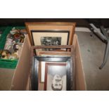 A box containing various photos and frames