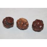 Three carved wooden Netsukes