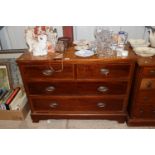 A mahogany chest of two short and two long drawers