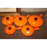 Five graduated Le Creuset saucepans