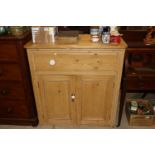 An antique pine storage cupboard fitted single dra